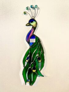 A simple Peacock design using some wonderful coloured glasses and a wired beaded crown. Approx dimensions 18 x 8 cm